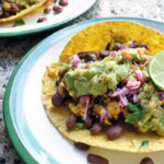 Hearty Vegan Breakfast Tacos with Creamy Beans & Guac